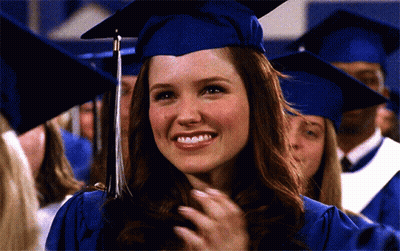 Woman In Graduation Cap And Gown Smiling GIF