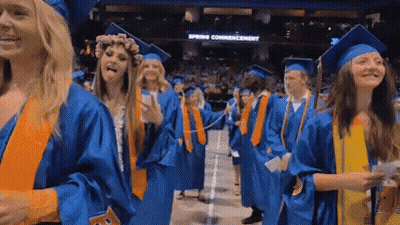 Woman In Graduation Cap And Gown Smiling GIF