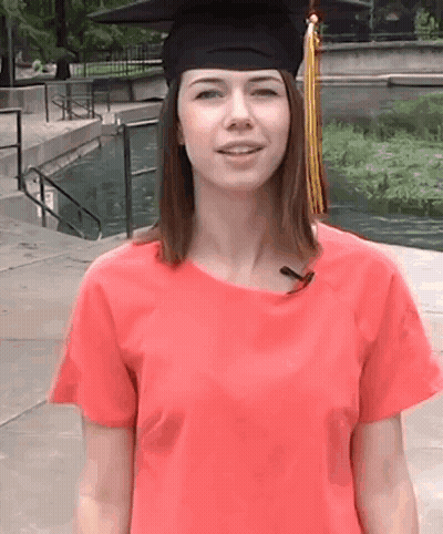 Woman In Graduation Cap And Gown Smiling GIF