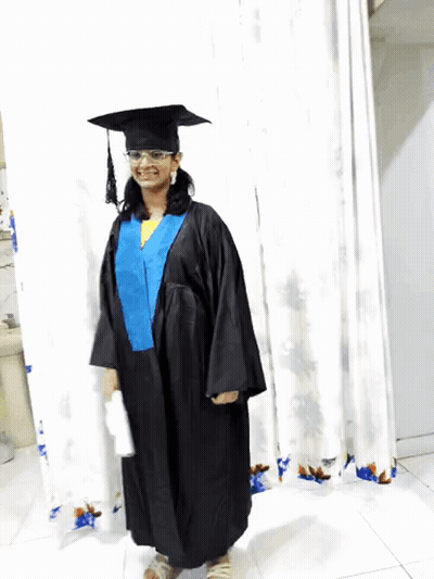 Woman In Graduation Cap And Gown Smiling GIF