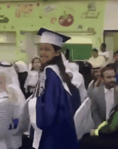 Woman In Graduation Cap And Gown GIF