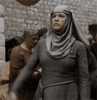 Woman In Gray Dress And Head Scarf GIF