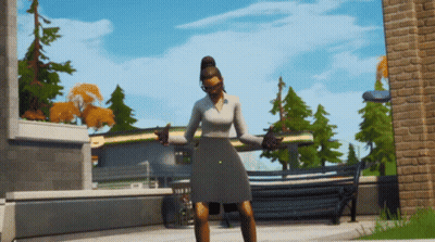Woman In Gray Dress In Front Of Brick Building GIF