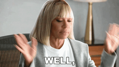 Woman In Gray Jacket Saying Well GIF