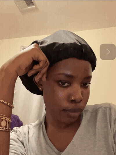 Woman In Gray Shirt And Black Hat GIF