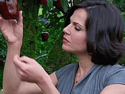 Woman In Gray Shirt Holding Red Apple GIF