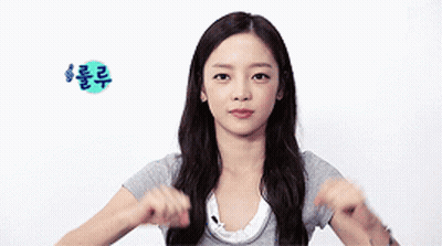Woman In Gray Shirt Making Funny Face GIF
