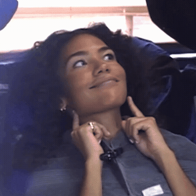 Woman In Gray Shirt With White Patch On Sleeve GIF