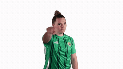Woman In Green Adidas Jersey Pointing At Camera GIF