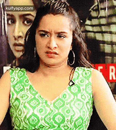 Woman In Green And White Dress Making Face GIF