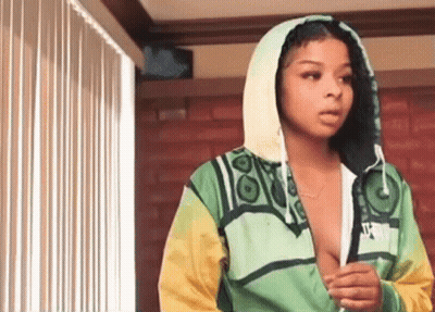 Woman In Green And Yellow Jacket With Hood GIF