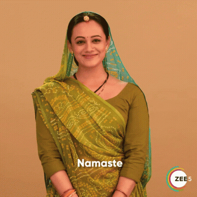 Woman In Green And Yellow Saree Saying Namaste GIF