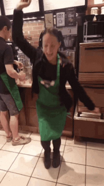 Woman In Green Apron Dancing GIF