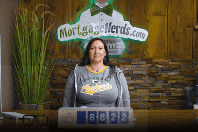 Woman In Green Bay Packers Shirt At Desk GIF