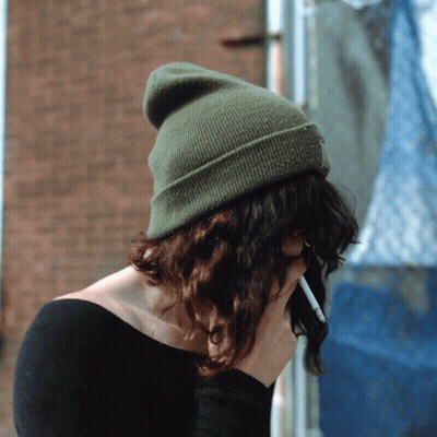Woman In Green Beanie Holding Cigarette GIF
