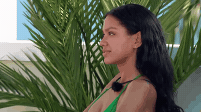 Woman In Green Bikini Next To Palm Tree GIF
