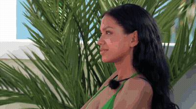 Woman In Green Bikini Smiling In Front Of Palm Tree GIF