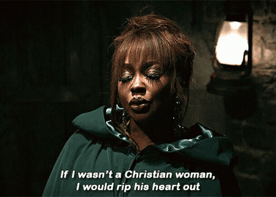 Woman In Green Cape Saying If I Wasn't A Christian Woman I Would Rip His Heart Out GIF