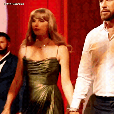 Woman In Green Dress And Man In White Shirt Holding Hands GIF