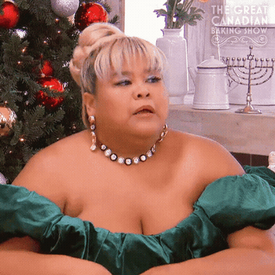 Woman In Green Dress By Christmas Tree Saying The Great Canadian Baking Show GIF