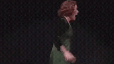 Woman In Green Dress Dancing On Stage GIF