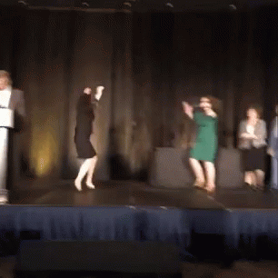Woman In Green Dress Dancing On Stage GIF