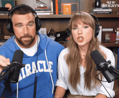 Woman In Green Dress Holding Hands With Man In White Shirt GIF