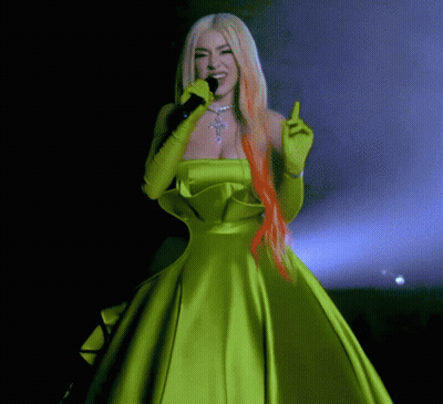 Woman In Green Dress Holding Microphone GIF