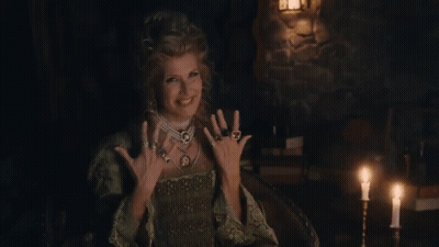 Woman In Green Dress In Candlelit Room GIF