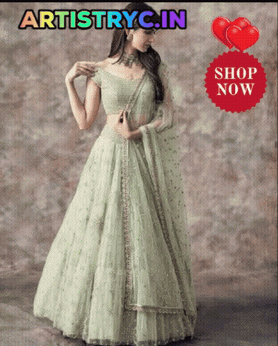 Woman In Green Dress In Front Of Artistry Sign GIF