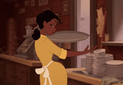 Woman In Green Dress Next To Bed GIF