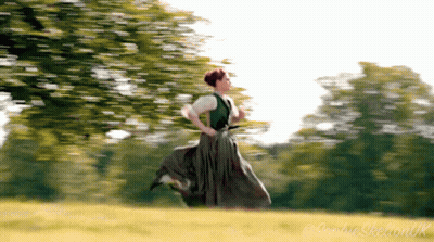 Woman In Green Dress Running Across Field GIF