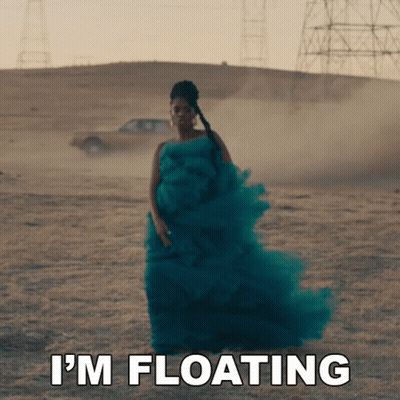 Woman In Green Dress Says I'm Floating In Front Of Car GIF