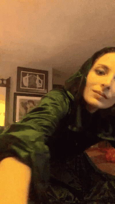 Woman In Green Dress Taking Selfie In Mirror GIF
