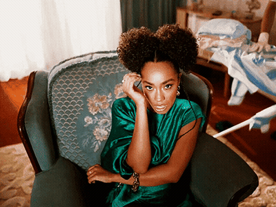 Woman In Green Dress Talking On Cell Phone GIF