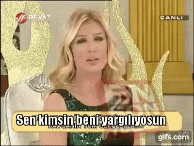 Woman In Green Dress With Sign Sen Kimsin Beni Vargilyosun GIF