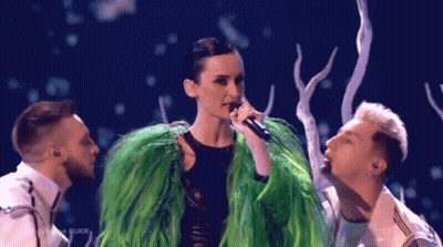 Woman In Green Fur Coat Singing GIF