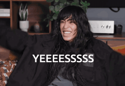 Woman In Green Fur Coat Singing GIF