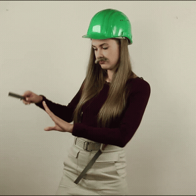 Woman In Green Hard Hat With Mustache GIF