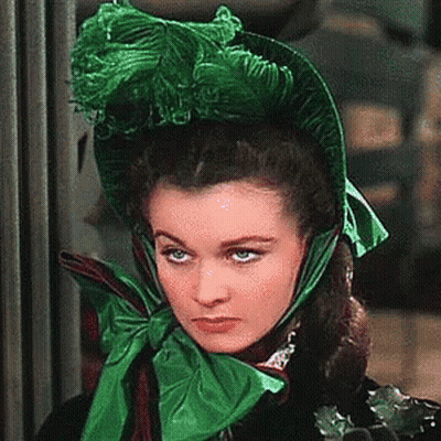 Woman In Green Hat And Scarf GIF