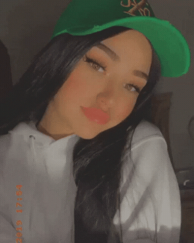 Woman In Green Hat And White Hoodie 2019 GIF