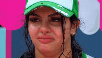 Woman In Green Hat Making Face GIF