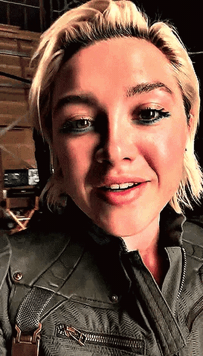 Woman In Green Jacket And Suspenders Close Up GIF