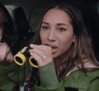 Woman In Green Jacket Holding Binoculars GIF