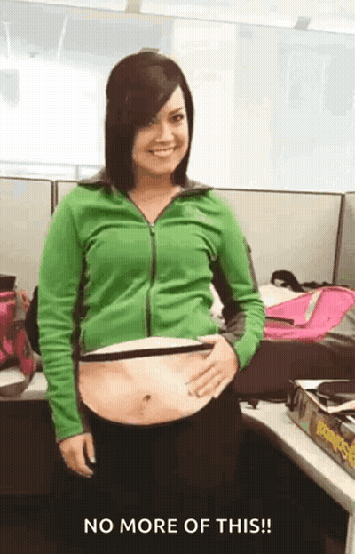 Woman In Green Jacket Holding Stomach No More GIF