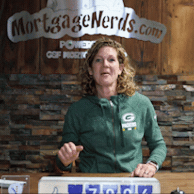 Woman In Green Jacket In Front Of Mortgage Nerds Sign GIF