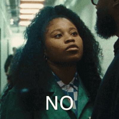Woman In Green Jacket Standing Next To Man Saying No GIF