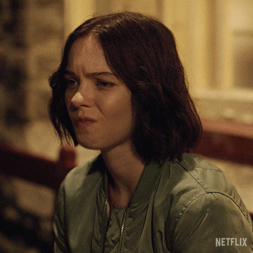 Woman In Green Jacket With Netflix Logo GIF