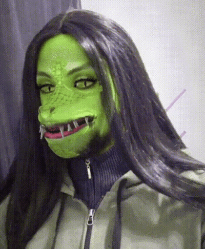 Woman In Green Mask With Sharp Teeth GIF