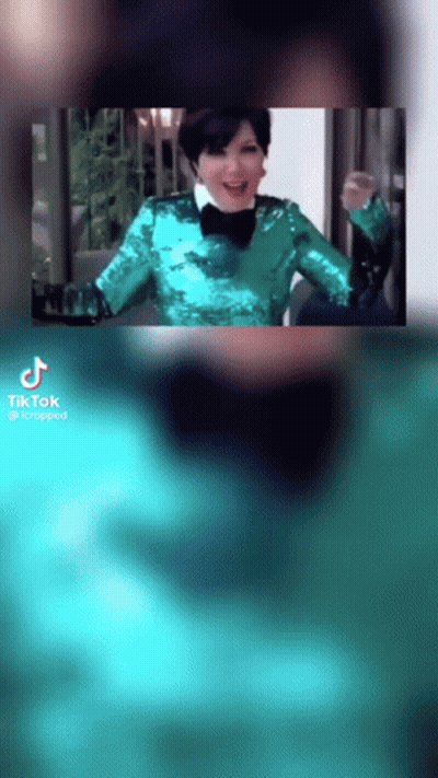 Woman In Green Sequined Jacket And Bow Tie Smiling GIF